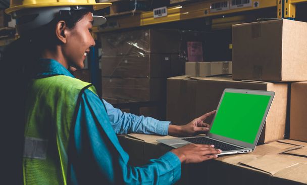 Computer with green screen display in warehouse storage room - Fotó, kép