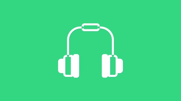 Bílá sluchátka ikona izolované na zeleném pozadí. Sluchátka. Koncepce poslechu hudby, služeb, komunikace a operátora. Grafická animace pohybu videa 4K - Záběry, video