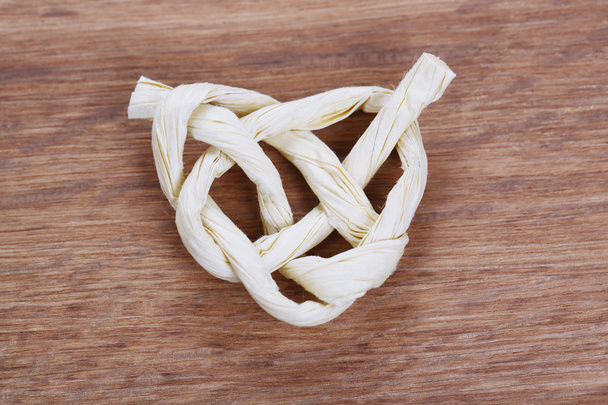Heart shape from rope, on wooden background - Photo, Image