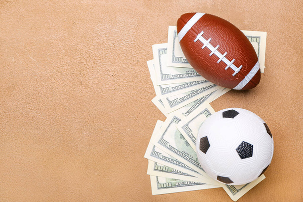 Money and balls on color background. Concept of sports bet - Photo, Image