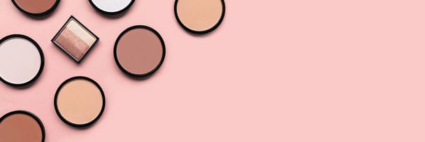 Beige blush, eyeshadow and face powder on pink background. Banner. Makeup. Brown cosmetic products. Tone foundation. - Foto, Imagem