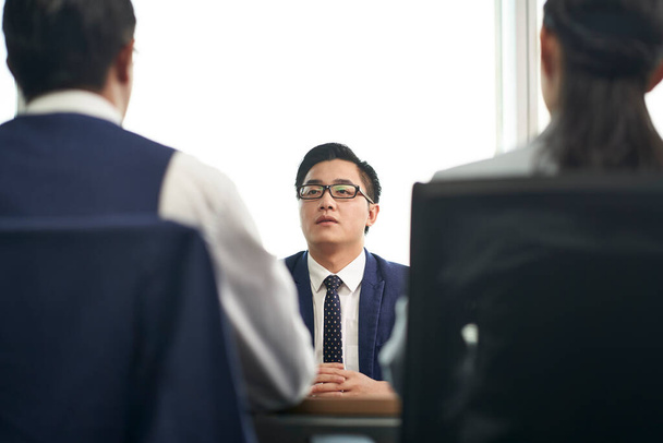 young asian business man job candidate talking to hr people during employment interview - Photo, Image