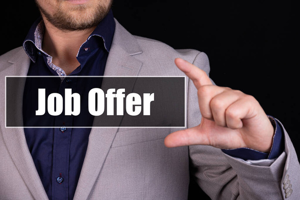 JOB OFFER text is written on the background of a businessman. Business concept. - 写真・画像