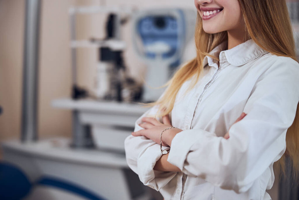 Pretty young lady in stylish clothes spending time in ophthalmology cabinet - Photo, Image