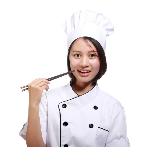 Beautiful woman chef with chopsticks - Фото, изображение