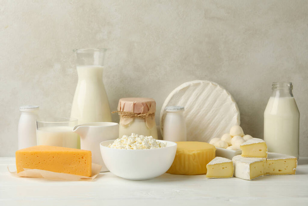 Different fresh dairy products on white wooden table - Photo, Image