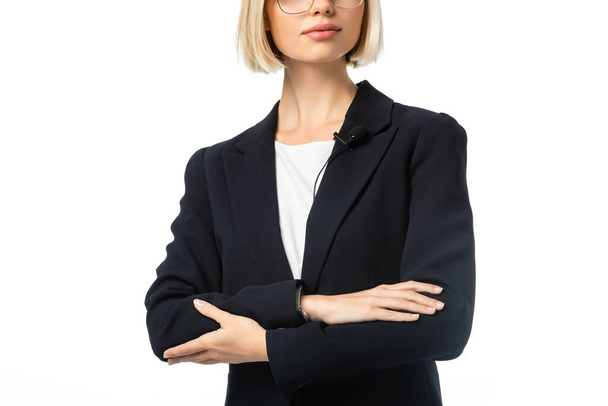 partial view of anchorwoman in black blazer standing with crossed arms isolated on white - Photo, Image