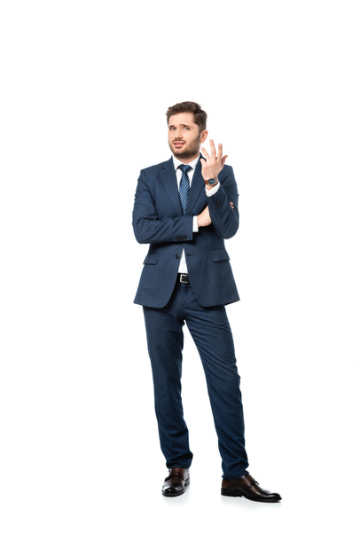 full length view of discouraged businessman looking at camera on white - Photo, Image