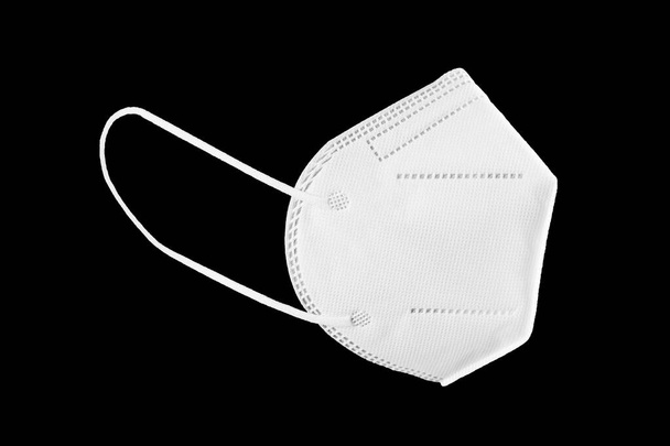 KN95, FFP2, FFP3 Face mask isolated on black background. Personal protective equipment against coronavirus Covid-19 - Fotó, kép
