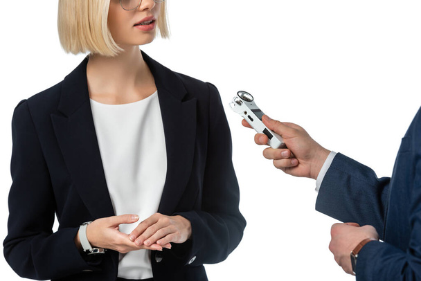 cropped view of anchorman with dictaphone taking interview from businesswoman isolated on white - Photo, Image