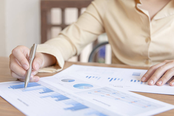 Financial businesswomen analyze the graph of the company's performance to create profits and growth, Market research reports and income statistics, Financial and Accounting concept. - Photo, Image