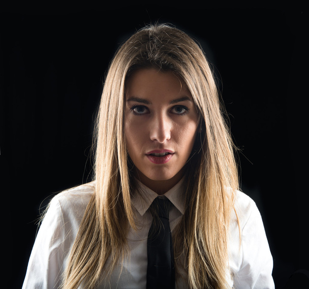 Young businesswoman over isolated black background  - Valokuva, kuva