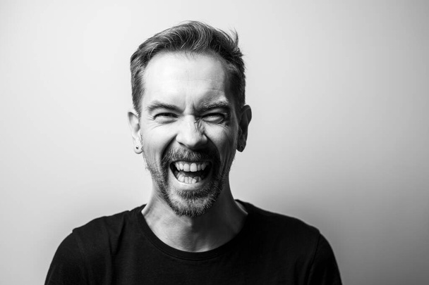 Portrait of a mad man. Black and white - Photo, image