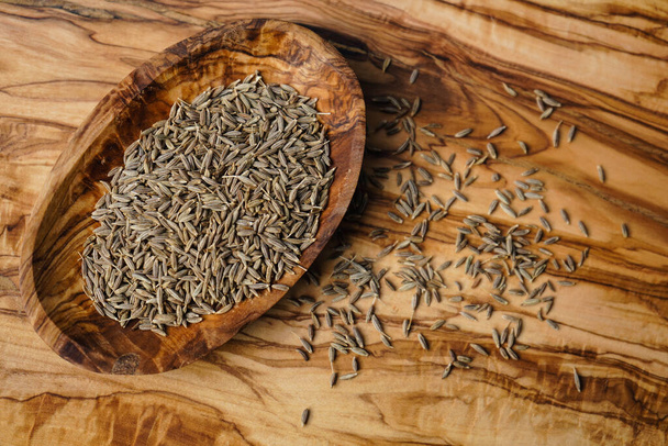 caraway seeds on olive wood - Photo, Image