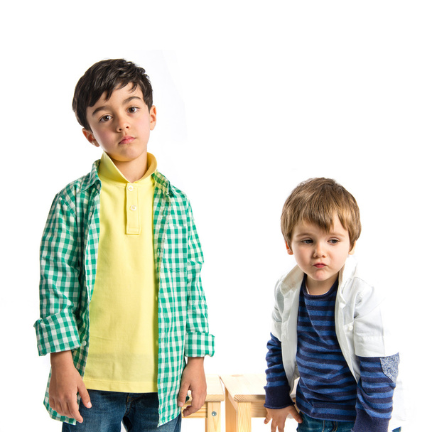 Two kids over white background - Photo, image