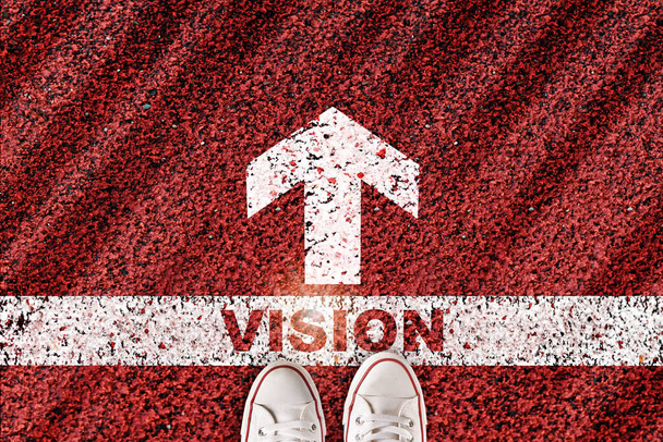 Vision word on starting line with arrow on red road background. Business go ahead concept and keep moving and success idea - Photo, Image