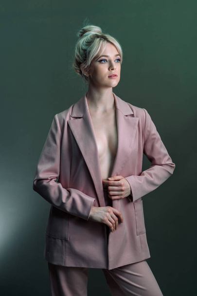 Sexy young blonde, a jacket dressed on a naked body-2. - Photo, image
