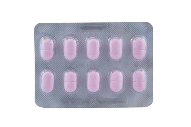 Довга форма рожевої таблетки в блістерній упаковці
 - Фото, зображення