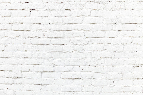 detail van wit geschilderde bakstenen muur geeft een harmonische achtergrond - Foto, afbeelding