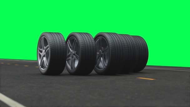 Loop 4 car wheels driving on the road on a green background - Footage, Video