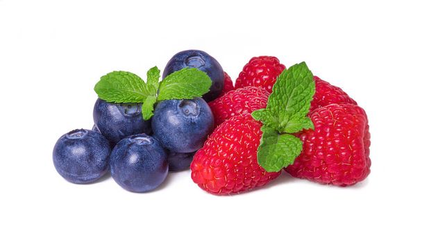 Ripe sweet raspberries and blueberries isolated on a white background - Zdjęcie, obraz