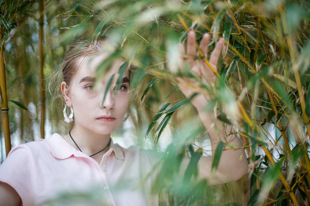 White young girl on the background of trees - Fotoğraf, Görsel