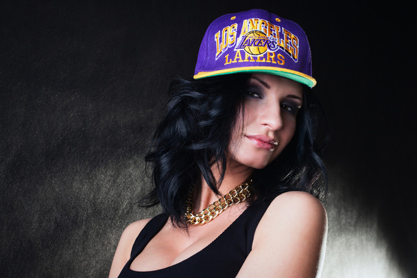 Pretty Sexy brunette in a purple cap - Photo, image