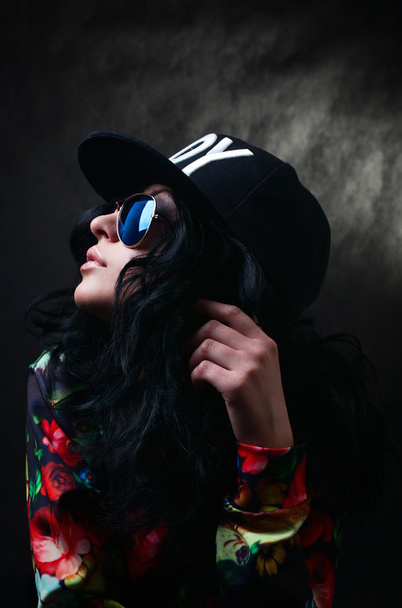 Pretty Sexy brunette in a black cap and glasses. Swag girl. Fash - Foto, afbeelding