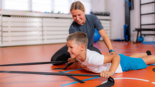Back exercise for children, using resistance bands - Fotoğraf, Görsel