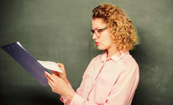 essay writing. teacher with document folder. student in glasses at blackboard. girl teacher at private lesson. school year. Girl prepare for exams. report project. back to school. Capricious girl - Foto, Imagen