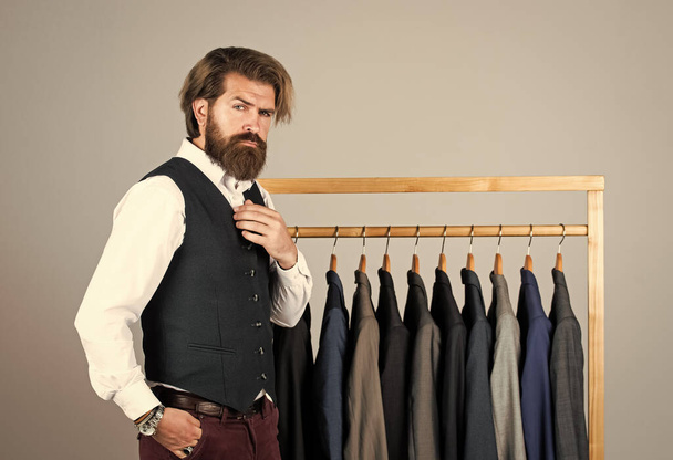 formal and office wardrobe. businessman. confident tailor designing male jacket. handsome sartor with tape measure. male beauty and fashion. bearded man tailoring clothes - Foto, afbeelding