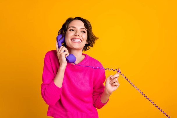 Photo of satisfied girl call telephone listen enjoy news wear jumper isolated over bright color background - Valokuva, kuva