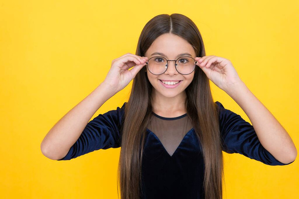 happy teen girl wearing glasses because of bad eyesight, oculist - Fotoğraf, Görsel