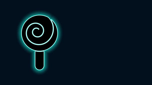 Świecąca neonowa ikona lizaka odizolowana na czarnym tle. Znak słodyczy. Jedzenie, pyszny symbol. 4K Animacja graficzna ruchu wideo - Materiał filmowy, wideo