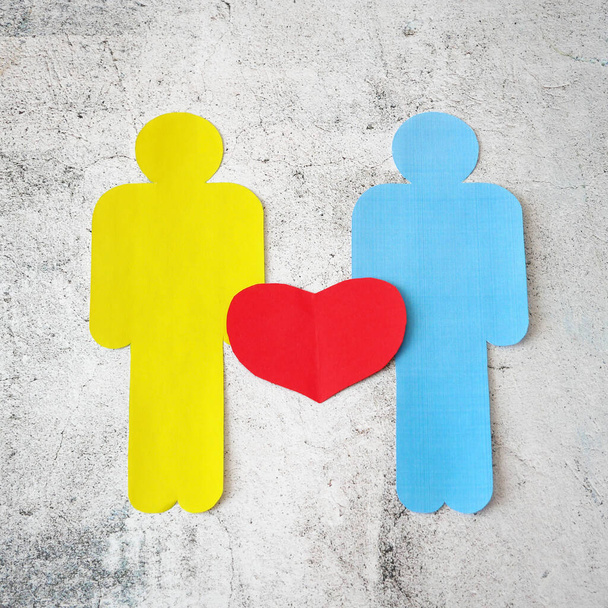 Two people sign with paper heart symbol on  gray background, lgbt  - Foto, immagini
