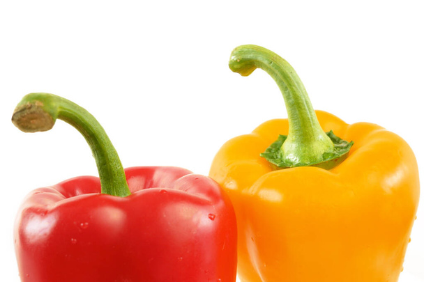 red and yellow sweet peppers on white background, bellpeppers, paprika, closeu - Photo, Image