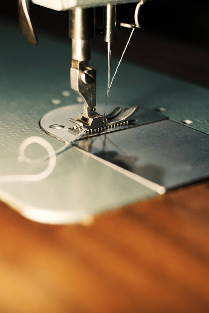 Close-up of a sewing machine with illuminated work area - Valokuva, kuva