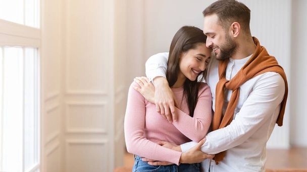 Young Couple In Love Hugging Standing At Home, Panorama - Photo, Image