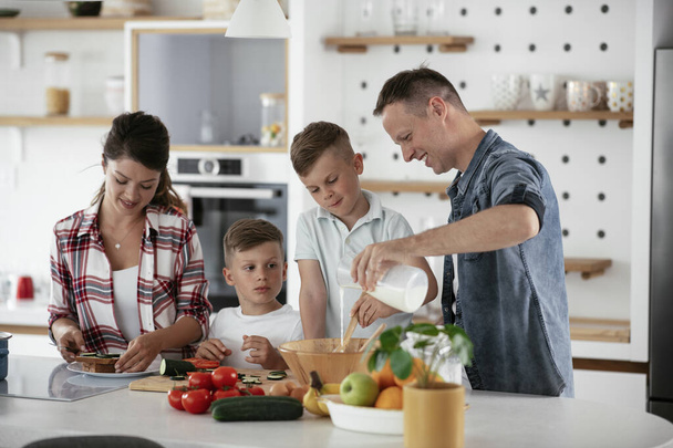 family having fun on kitchen - Photo, Image