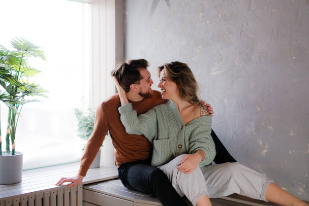 Man and woman sitting in an embrace. Romantic relationship - Fotó, kép