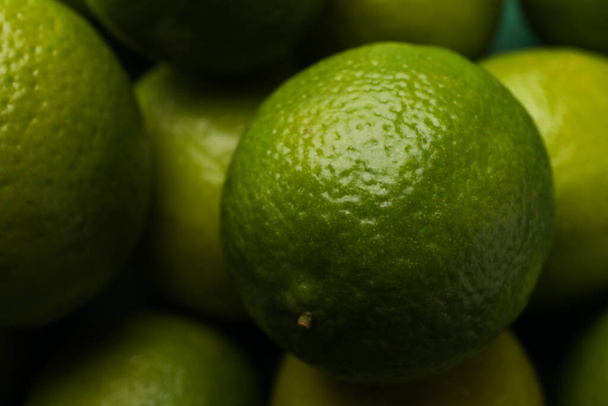 Fresh ripe lime on whole background, close up - Foto, afbeelding