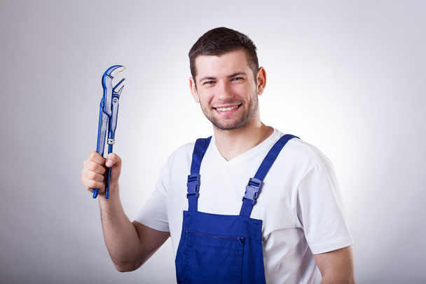 Repairman with wrench - Foto, imagen
