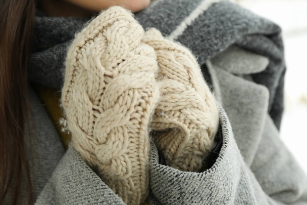 Woman in mittens outdoor in winter, close up - Photo, Image