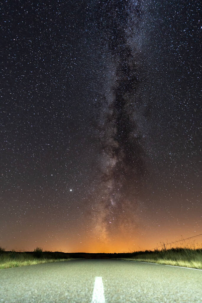 Empty road and milky way over it - Photo, Image