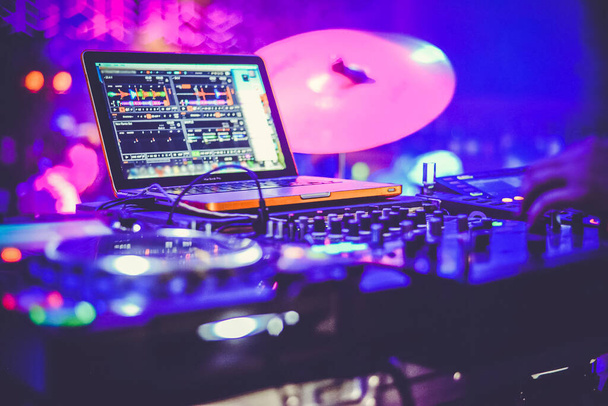 DJ at the remote control. Mixer remote at the concert. Musical equipment. - Photo, Image