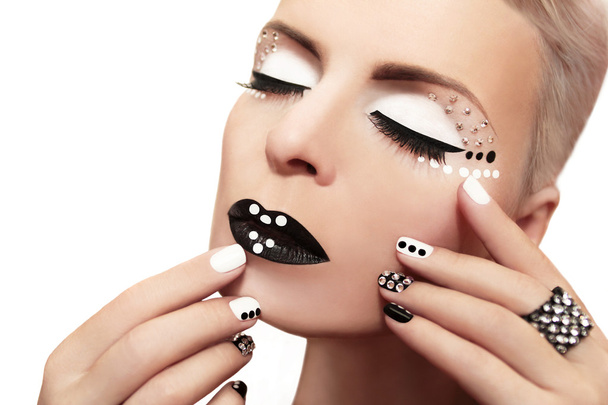 Makeup with rhinestones and manicure. - Фото, изображение