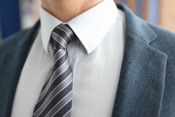 Closeup of businessman in striped tie and jacket - Photo, Image