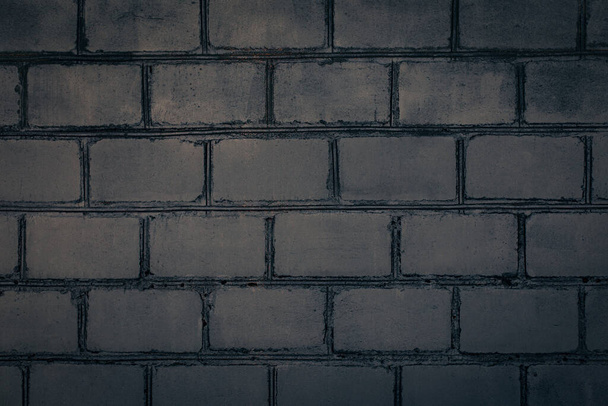 Dark grey brick wall. Abstract decorative grey background or art texture. Copy space.  - Photo, Image