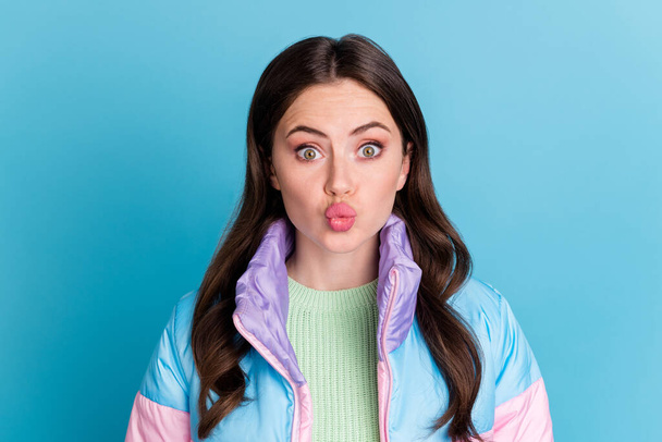Photo portrait of pouting woman isolated on pastel blue colored background - Foto, afbeelding