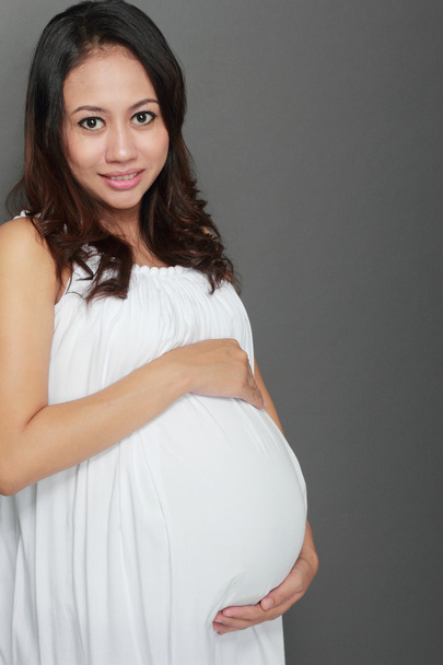 美しいアジアの妊娠中の女性δύο πρόσωπα ευτυχισμένη τη νέα επιχείρηση που εργάζονται - 写真・画像